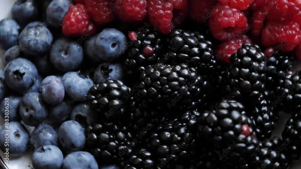 Colorful mix seasonal summer berries raspberries, blueberries, blackberries close-up, background. Healthy foods with antioxidants Colorful mix seasonal summer berries raspberries, blueberries, blackberries close-up, background. Healthy foods with antioxidants