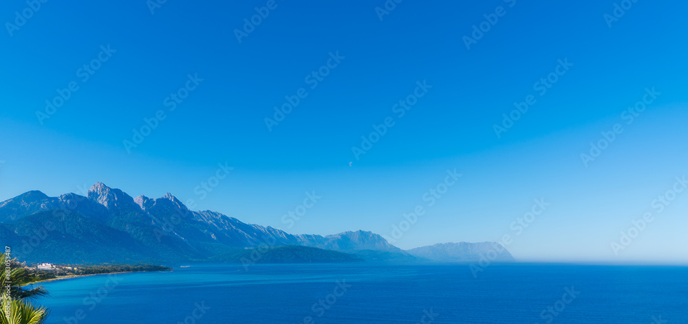 high mountain range on the horizon seascape high mountain range on the horizon seascape
