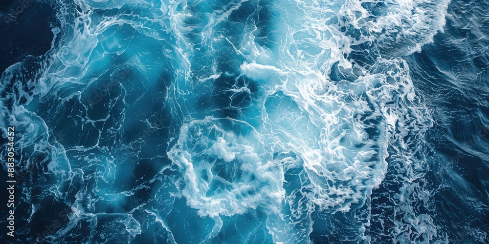 Spectacular aerial top view background photo of ocean sea water white wave splashing in the deep sea on blue waves. Surfing and vacations. Spectacular aerial top view background photo of ocean sea water white wave splashing in the deep sea on blue waves. Surfing and vacations.