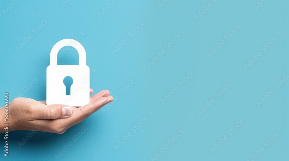 A hand holding white lock icon on blue background concept of illustrating security and protection A hand holding white lock icon on blue background concept of illustrating security and protection