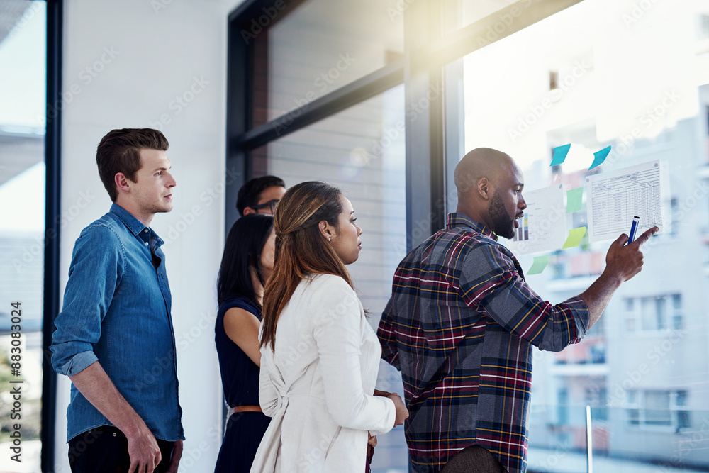 Obraz premium Business, people and planning with glass in office, campaign management and collaboration. Creative directors, graphs and discussion for project progress for content development by media agency.