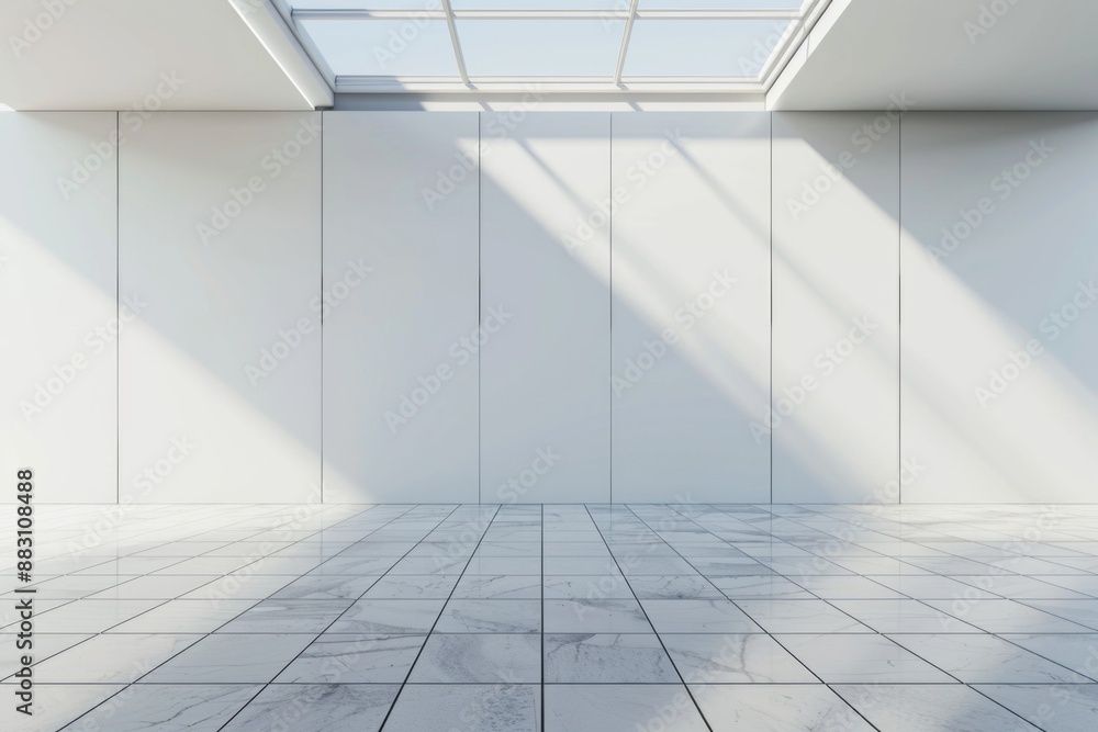 A white empty room with a large wall and skylight. A white empty room with a large wall and skylight.