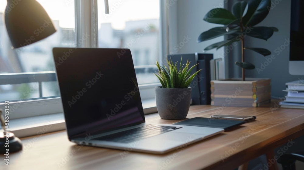 Laptop on Wooden Desk with Plant. Laptop on Wooden Desk with Plant.