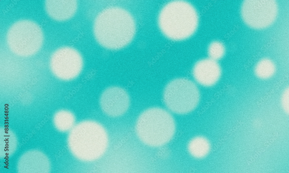 Abstract turquoise background with blurred white circles giving a grainy texture