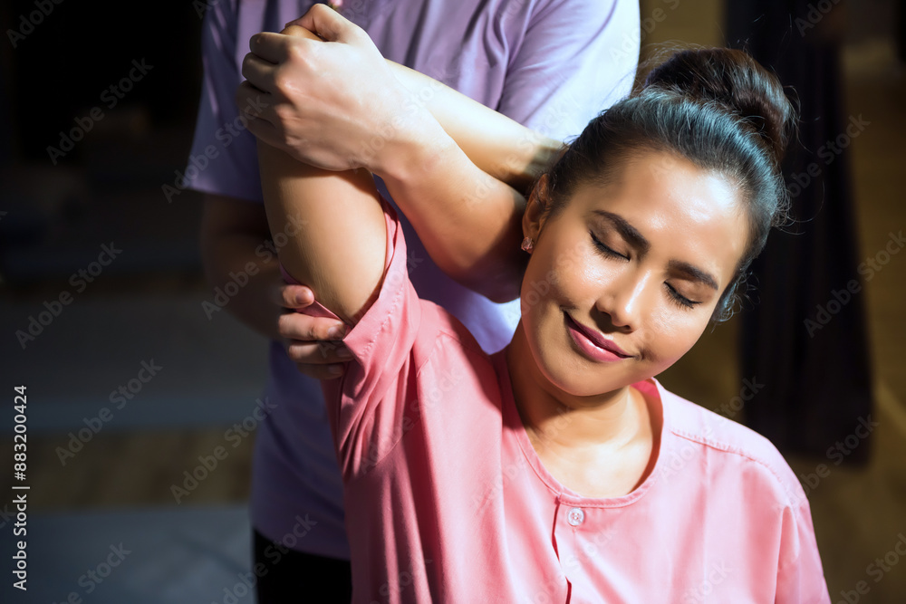 Thai massage by stretch elbow reflexology therapy to woman in spa Thai massage by stretch elbow reflexology therapy to woman in spa