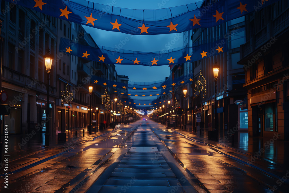 Wet, empty street in a European city at night, lit by street lamps and decorated with European Union flags Wet, empty street in a European city at night, lit by street lamps and decorated with European Union flags