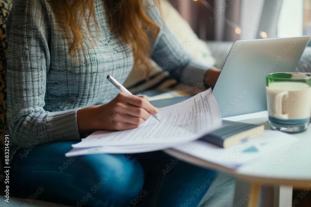 Prepare today for a secure tomorrow Cropped shot of a woman filling out paperwork at home Prepare today for a secure tomorrow Cropped shot of a woman filling out paperwork at home