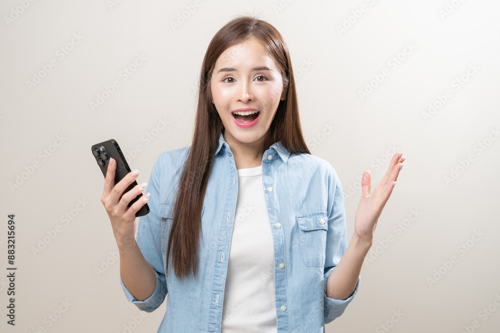 Happy asian young woman using mobile smart phone, read good news online, laugh excited getting offer, great positive surprise, celebrate success on smartphone. Smile girl isolated on white background. Happy asian young woman using mobile smart phone, read good news online, laugh excited getting offer, great positive surprise, celebrate success on smartphone. Smile girl isolated on white background.