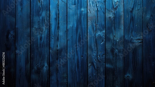 Weathered Blue Wooden Fence with Unique Patterns and Dark Blue Hue photo