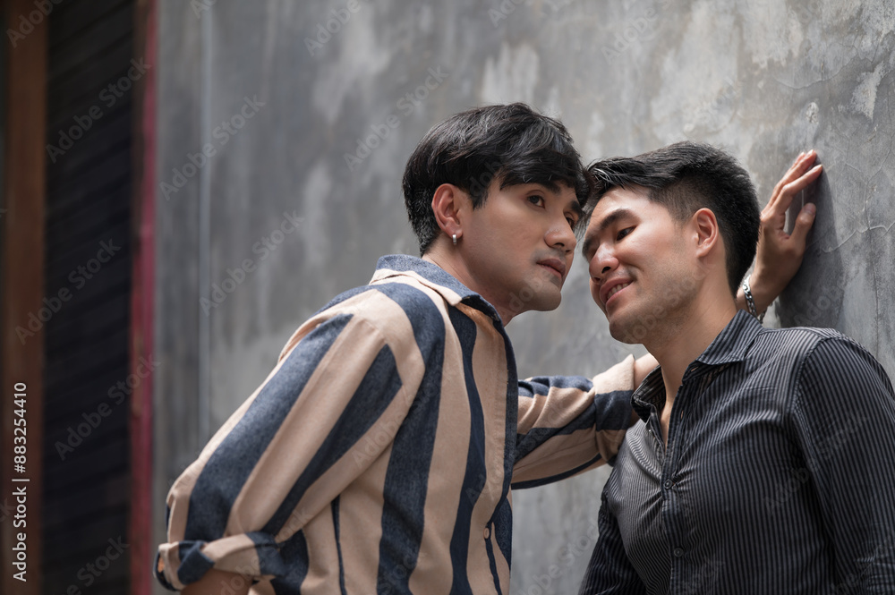 Portraits of happy Asian gay couple hugging and embracing
