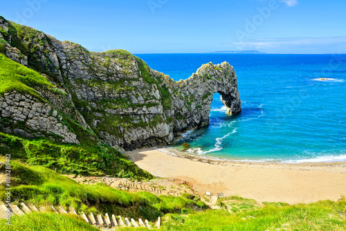 Bild auf Leinwand Scenic Durdle Door under blue skies, Dorset coast, England, UK