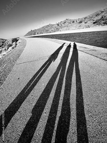 The shadow of 3 girls walking at the aqueduct in Lancaster, California, United states 