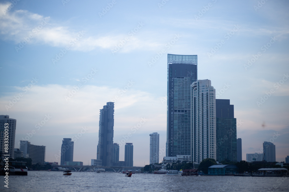 Fototapeta premium blue skyscape background with cloud and silhouette city town building in evening of the day sunrise dusk day time cityscape panorama