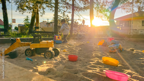 Sandbox outdoor. Children's wooden sandbox with various toys for the games