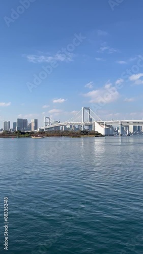 tokyo rainbow bridge at daytime odaiba japan clear sky light clouds