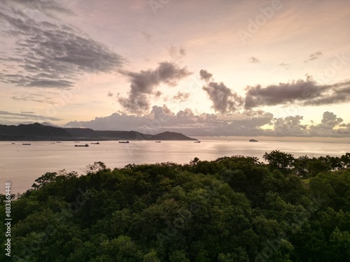 Beautiful Soft Sunrise Light Drone Aerial View towards Mimpang Tepekong Islands. photo