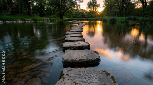 Calm river with a stone pathway photo