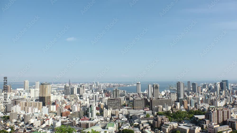 KOBE, HYOGO, JAPAN - JUNE 2024 : Aerial high angle view of Kobe city and Kobe port in daytime. View of buildings and street around Kobe port tower and Sannomiya station. KOBE, HYOGO, JAPAN - JUNE 2024 : Aerial high angle view of Kobe city and Kobe port in daytime. View of buildings and street around Kobe port tower and Sannomiya station.