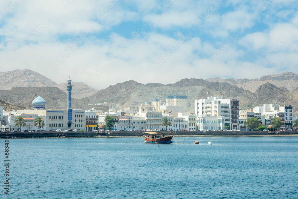 Mutrah promenade panorama with bay and traditional dhow boat anchored, Muscat, sultanate Oman Mutrah promenade panorama with bay and traditional dhow boat anchored, Muscat, sultanate Oman