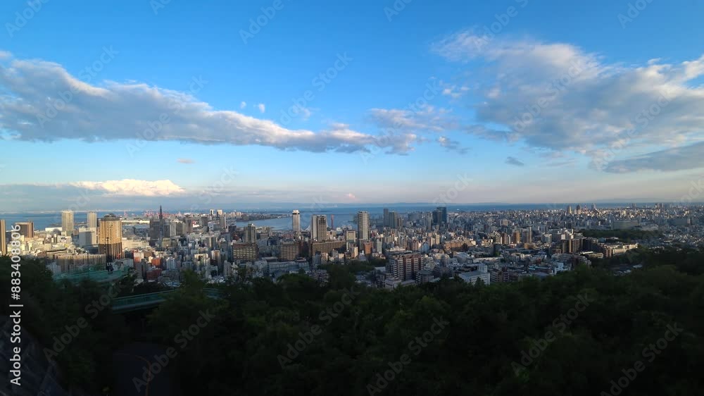 KOBE, HYOGO, JAPAN - JUNE 2024 : Aerial high angle view of Kobe city and Kobe port in sunset time. View of buildings and street around Kobe port tower and Sannomiya station. KOBE, HYOGO, JAPAN - JUNE 2024 : Aerial high angle view of Kobe city and Kobe port in sunset time. View of buildings and street around Kobe port tower and Sannomiya station.