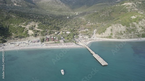 Aerial view of pier by Bunec Beach area in Summer 2022, Albania - raw data photo