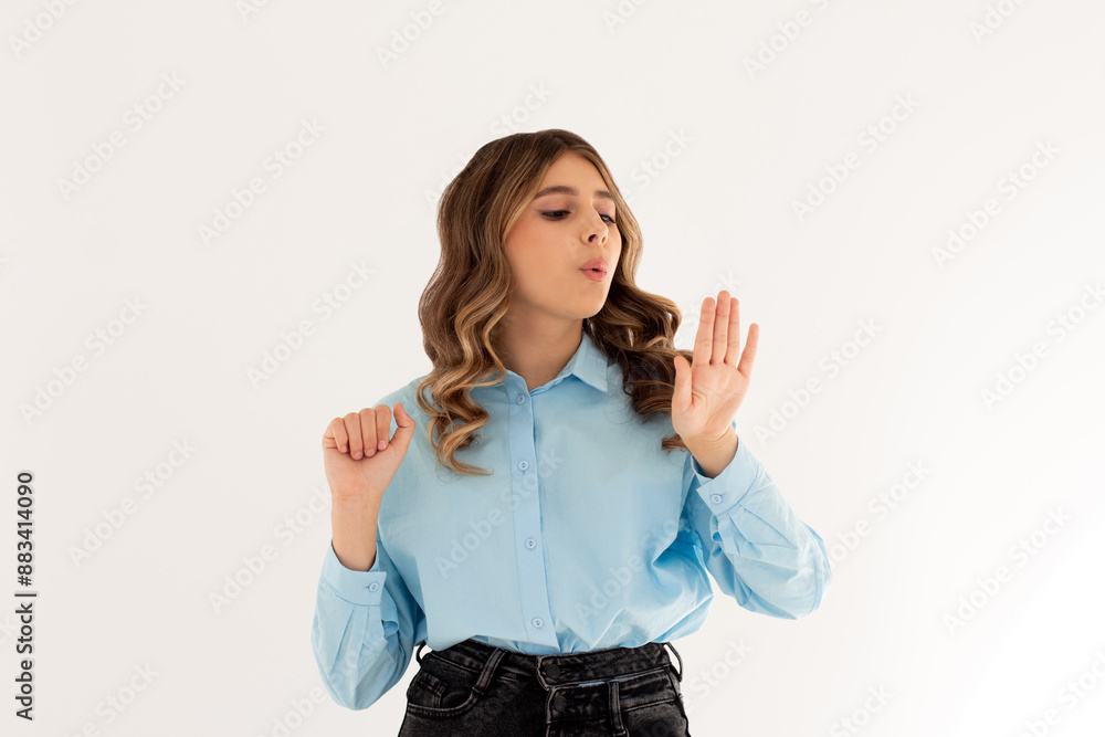 Young caucasian woman looking at manicure on white background Young caucasian woman looking at manicure on white background