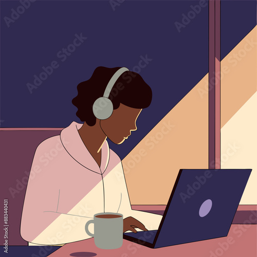 A person working from a coffee shop with a laptop and headphones