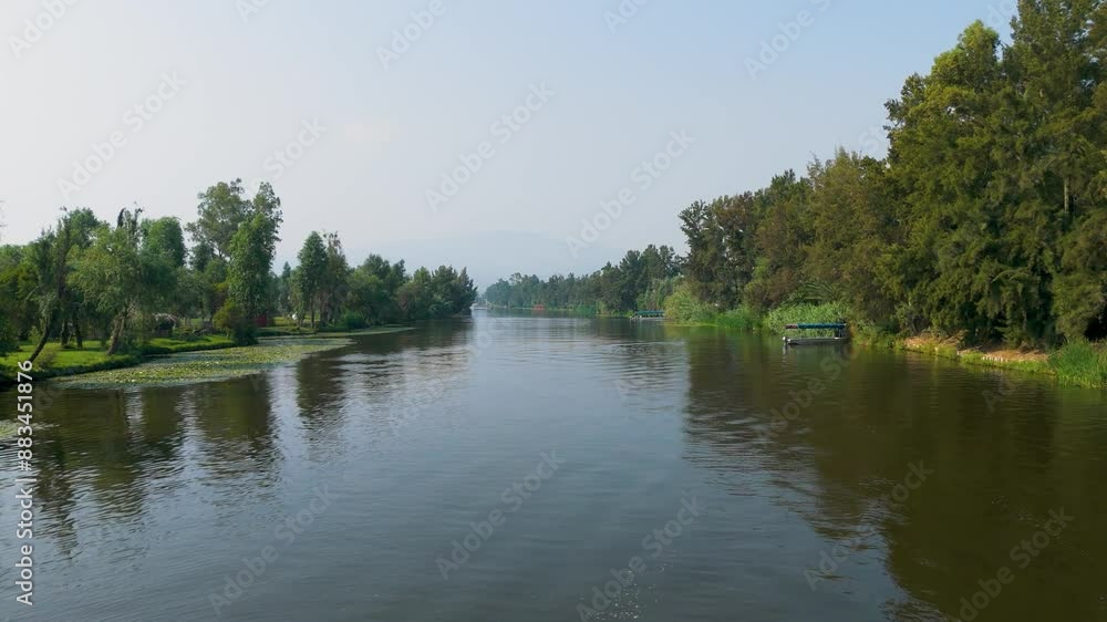 Aerial Video Journey Over Xochimilco Canals in Mexico City: Tranquil Waters Provide a Smooth and Peaceful Ride on Traditional Trajineras. Aerial Video Journey Over Xochimilco Canals in Mexico City: Tranquil Waters Provide a Smooth and Peaceful Ride on Traditional Trajineras.