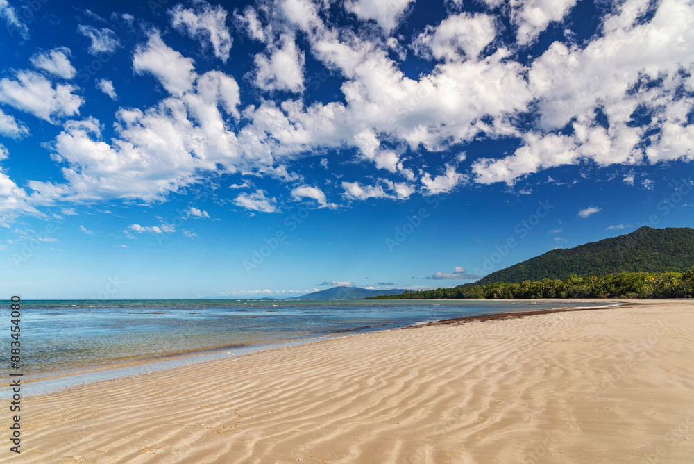 Picturesque tropical coastal sandy beach in Cape Tribulation, Queensland, Australia. Cape Tribulation is within Daintree National Park on Coral Sea. Picturesque tropical coastal sandy beach in Cape Tribulation, Queensland, Australia. Cape Tribulation is within Daintree National Park on Coral Sea.