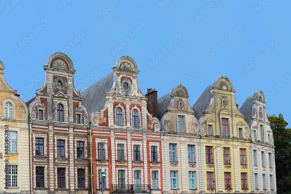 Fototapeta premium Typical antique houses in Flemish style with bell gables on the market place in Arras, Pas-de-Calais, France on a summer day with blue sky