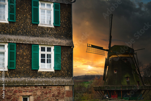 Canvas Print Vintage German House and Mill in Sunset