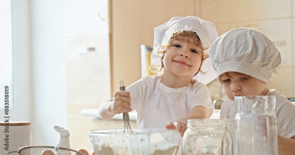 Little Chefs in Training: Boys Mixing Batter Together in Slow Motion Little Chefs in Training: Boys Mixing Batter Together in Slow Motion