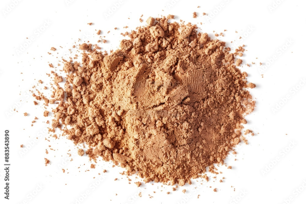 A close-up image of a pile of brown powder sitting on a white surface, suitable for use in scientific or educational contexts