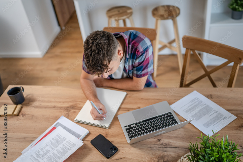 Young caucasian man teenager student study at home Young caucasian man teenager student study at home