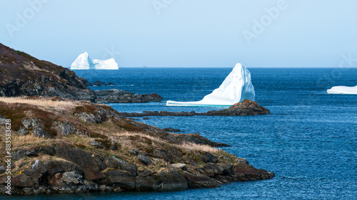 Arctic icebergs floating into Noble Cove in Little Quirpon, Newfoundland, Canada
 photo