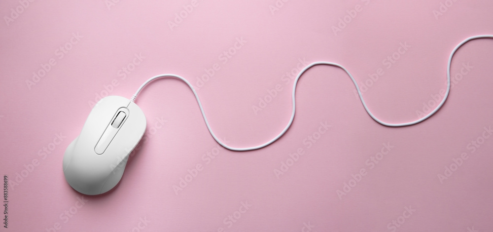Computer mouse on pink background, top view. Banner design with space for text Computer mouse on pink background, top view. Banner design with space for text