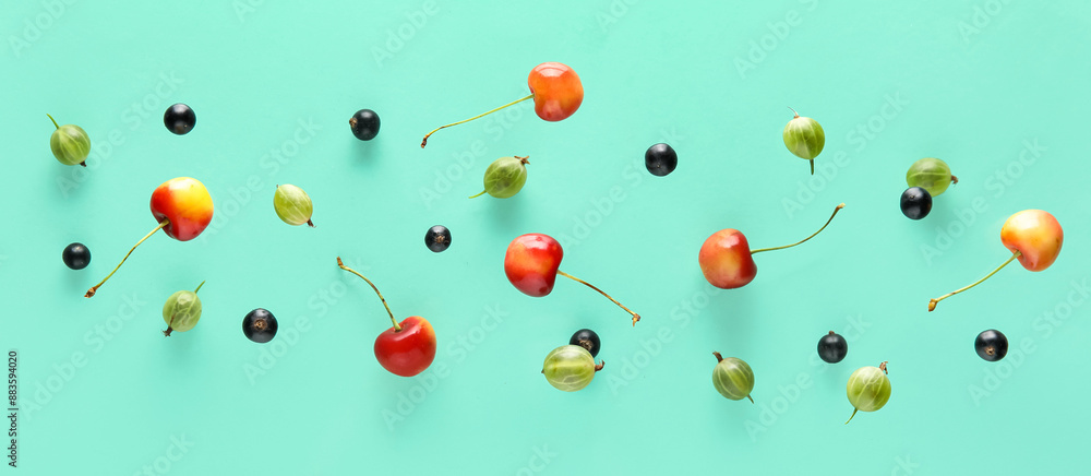 Different flying berries on turquoise background Different flying berries on turquoise background
