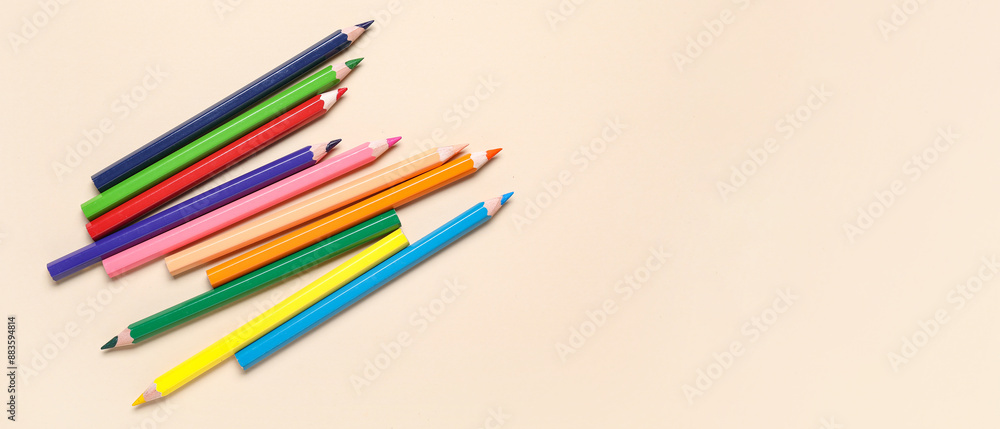 Fototapeta premium Colorful pencils on beige background