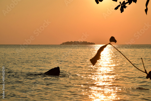 Beautiful sunset from a distance of small islands around the coast of Tanjung Gelam, Karimunjawa Islands, Central Java, Indonesia 