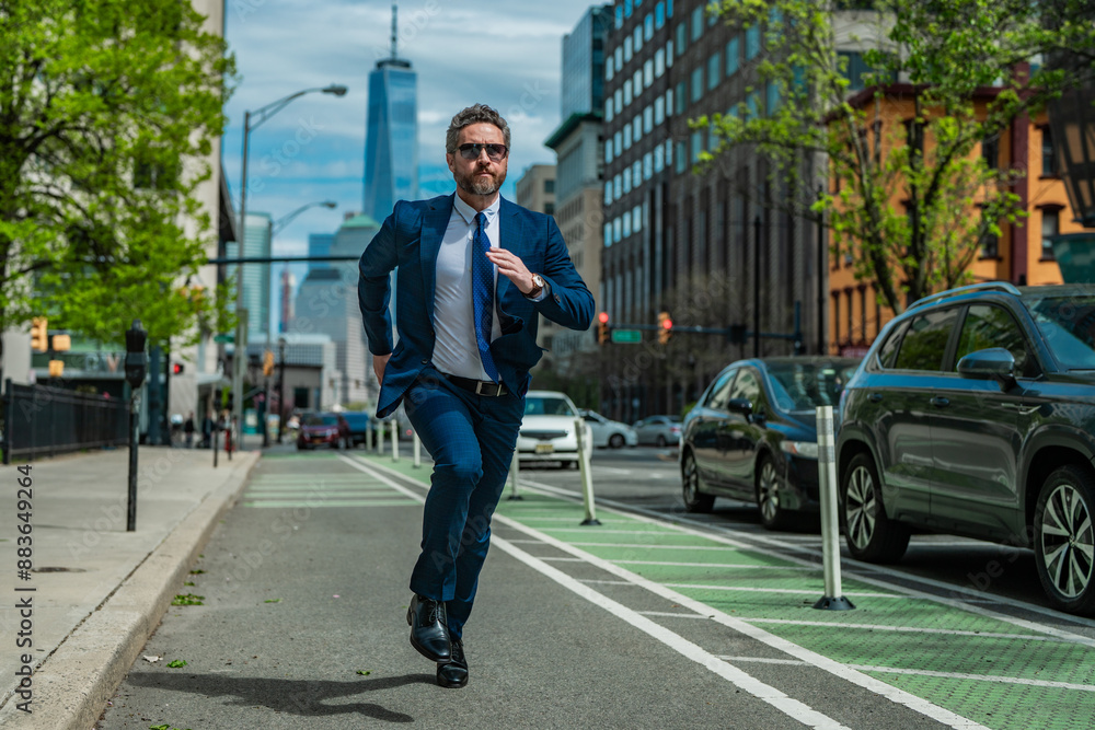 Business man in suit run in NY. American business. Businessman run down street, late for a meeting. Businessman in suit run be success. Running business man. Fast business. Run and late businessman. Business man in suit run in NY. American business. Businessman run down street, late for a meeting. Businessman in suit run be success. Running business man. Fast business. Run and late businessman.