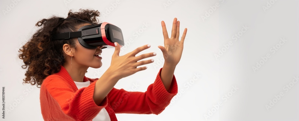 Obraz premium woman in vr glasses, playing video games or fitness and yoga with virtual reality headset, trying to touch something with hand