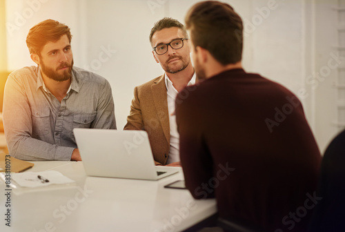 Business, team and men in office for meeting, brainstorming and proposal at laptop. Professional people, startup and profit planning at table for discussion, pitch and company development in finance photo