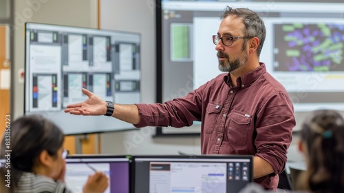 A religious studies professor lectures in a modernized classroom utilizing interactive whiteboards and digital resources to demonstrate modern interpretations. photo