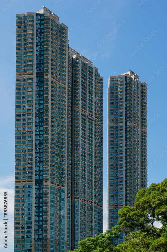 Tall glass and concrete buildings against a clear blue sky Tall glass and concrete buildings against a clear blue sky