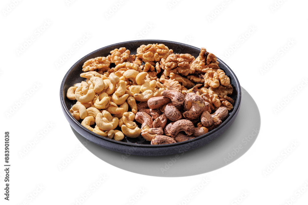 A plate of cashews and walnut kernels. On transparent background with transparent shadow. A plate of cashews and walnut kernels. On transparent background with transparent shadow.