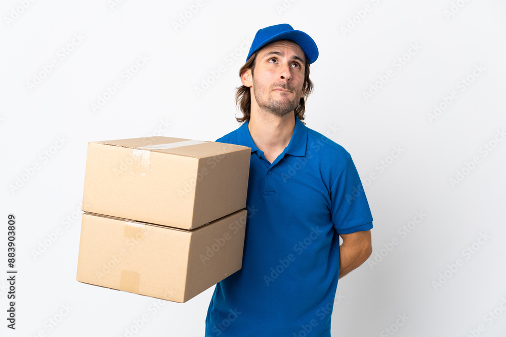 Delivery man isolated on white background and looking up Delivery man isolated on white background and looking up