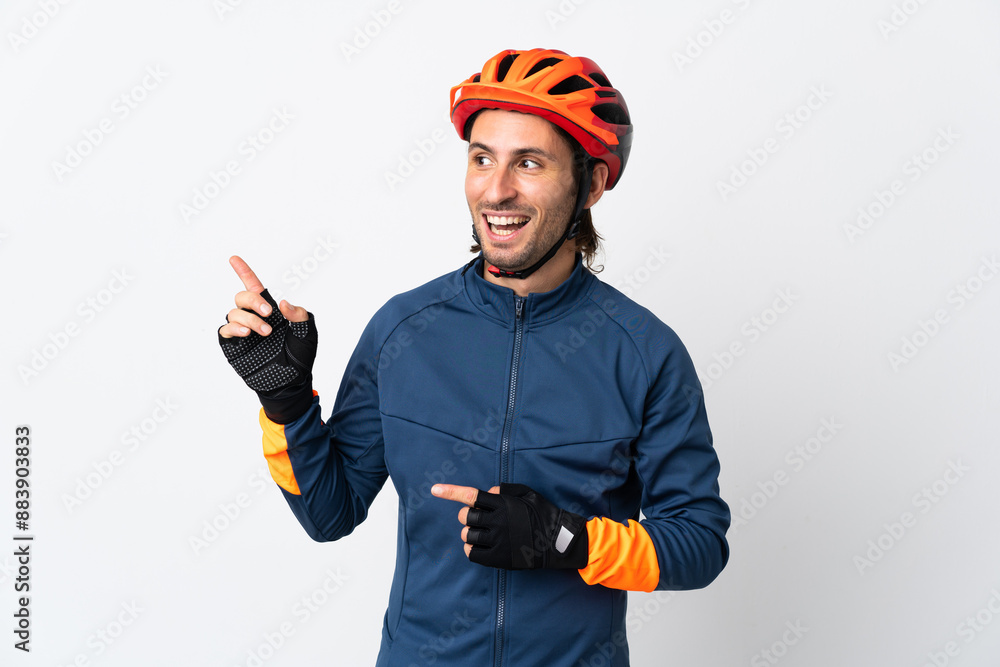 Young cyclist man isolated on white background intending to realizes the solution while lifting a finger up Young cyclist man isolated on white background intending to realizes the solution while lifting a finger up