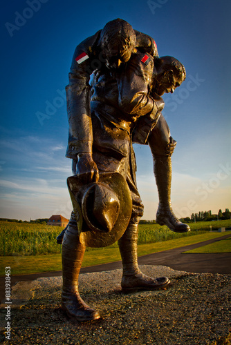 World War One history : bronze statue by Peter Corlett (the Cobbers Memorial). Fromelles WW1 battlefield site, France. photo