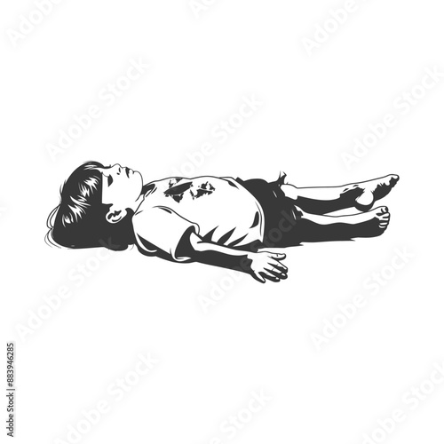 Young boy lying on the ground in a peaceful slumber