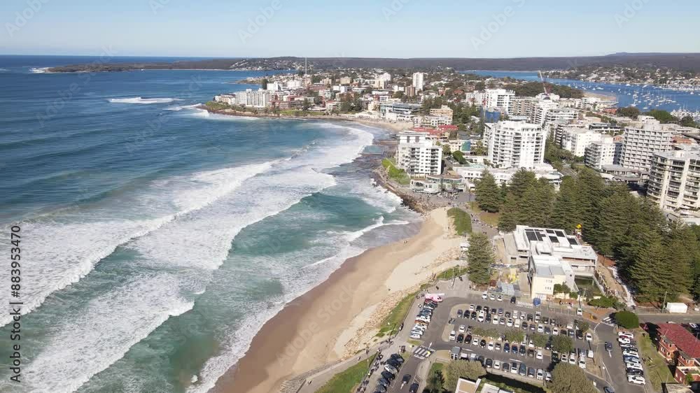 Aerial drone view of Cronulla beach in the Sutherland Shire, South Sydney, NSW Australia during high surf conditions on a sunny morning on 14 July 2024 heading toward Cronulla rock pools Aerial drone view of Cronulla beach in the Sutherland Shire, South Sydney, NSW Australia during high surf conditions on a sunny morning on 14 July 2024 heading toward Cronulla rock pools